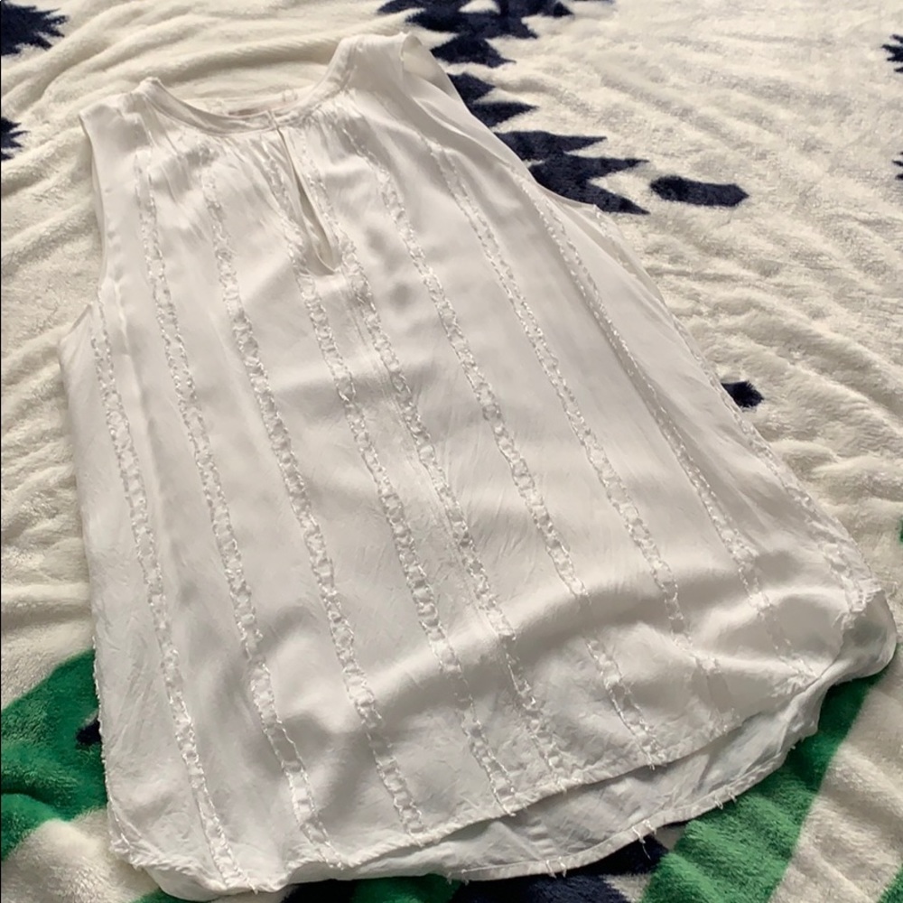 White sleeveless blouse